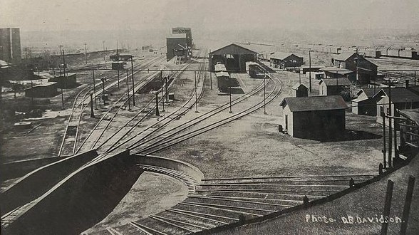 1923 - The large 120' turntable in the foreground routed the big locomotives into the roundhouse bays for maintenance and repairs. When Waynoka became a division point on the Santa Fe Railroad in 1910, the roundhouse was enlarged from 10 bays to 16.  Each new bay was 132' deep to accommodate the 110' Mallet engines. Waynoka’s rail yards became the largest in the State of Oklahoma.  Photo taken from the roundhouse rood by D.B. Davidson